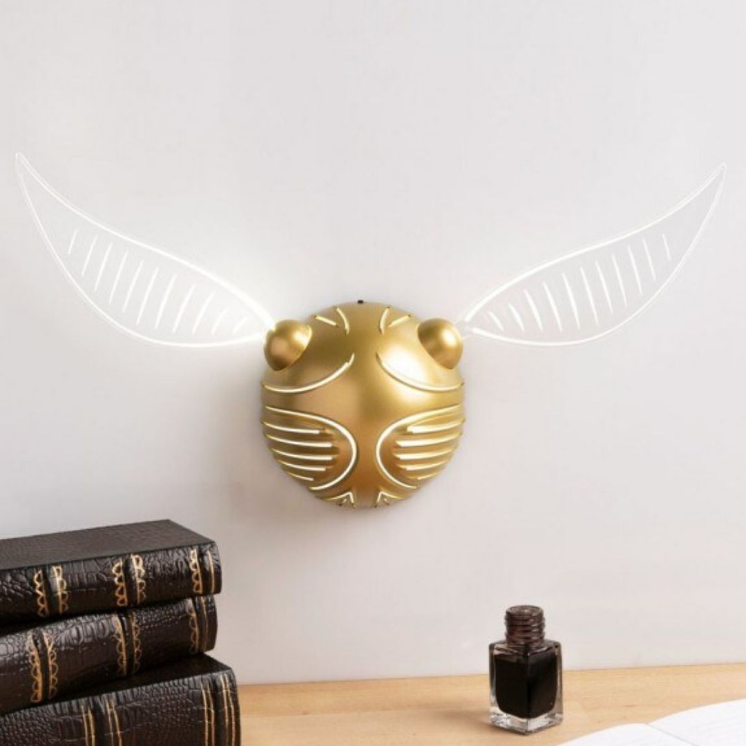 vif d'or accroché au mur